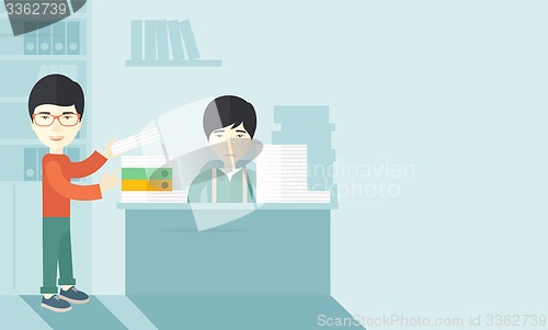 Image of Two asian office clerk inside the office.