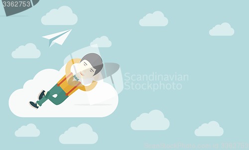 Image of Asian man lying on a cloud with paper plane.