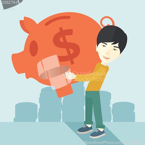 Image of Chinese businessman carries a big piggy bank for saving money.