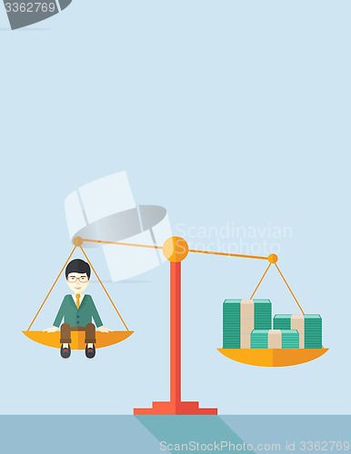 Image of Japanese Businessman on a balance scale