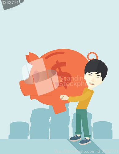 Image of Chinese businessman carries a big piggy bank for saving money.