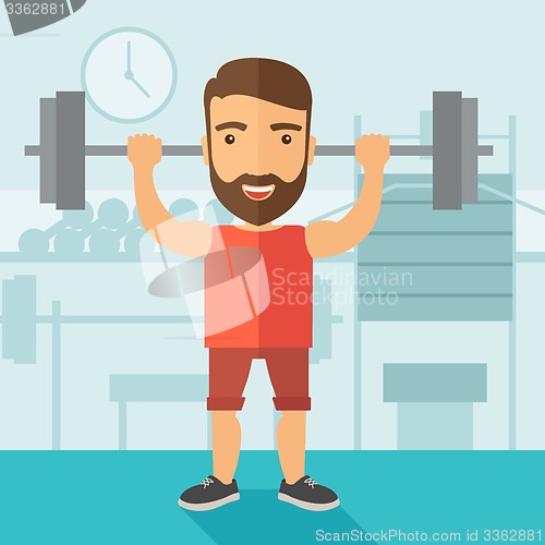 Image of Handsome man lifting a barbell