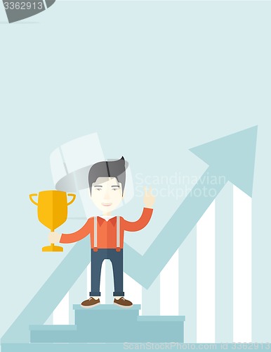 Image of Asian man standing on the winning podium