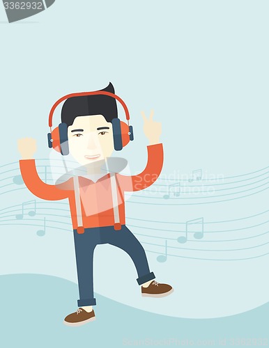 Image of Happy young man dancing while listening to music.