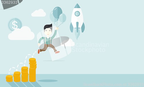 Image of Asian businessman holding balloons.