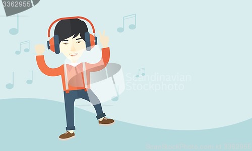 Image of Happy young man dancing while listening to music.