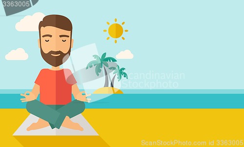 Image of Man doing yoga in the beach