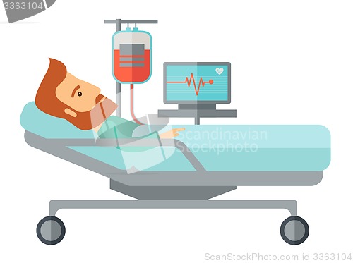 Image of Patient in hospital bed being monitored