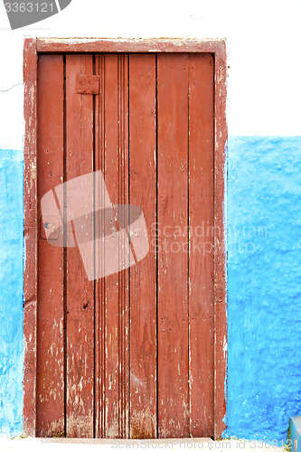 Image of historical blue  in  antique building door morocco      style af