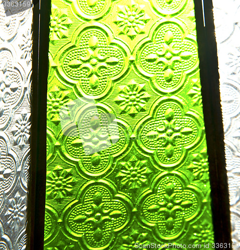 Image of colorated glass and sun in morocco africa window and light