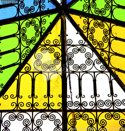 Image of colorated glass and sun in morocco africa window and light