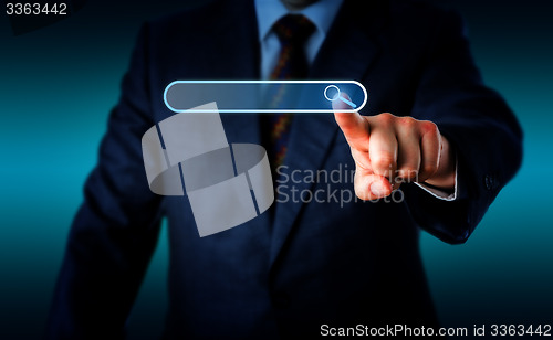 Image of Businessman Touching Magnifier Icon In Search Box