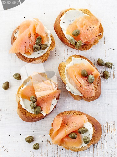 Image of toasted bread with cream cheese and salmon fillet