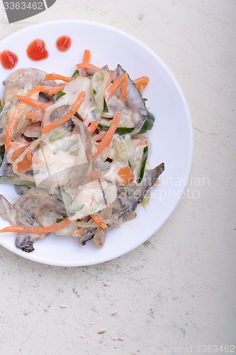 Image of mushroom salad with champignon and fresh carrots, white plate on white plate with watercolor