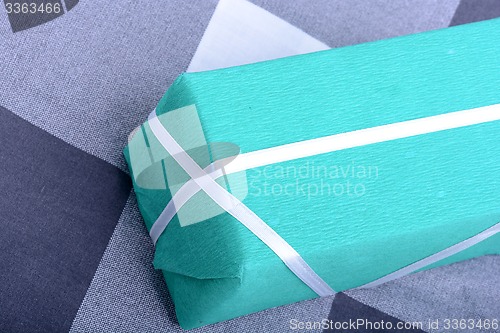 Image of Green gift box with white ribbon