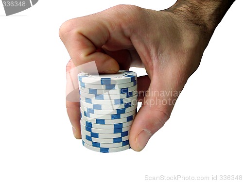 Image of hand with casino chips