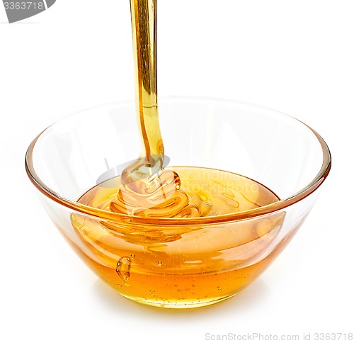 Image of honey pouring into bowl