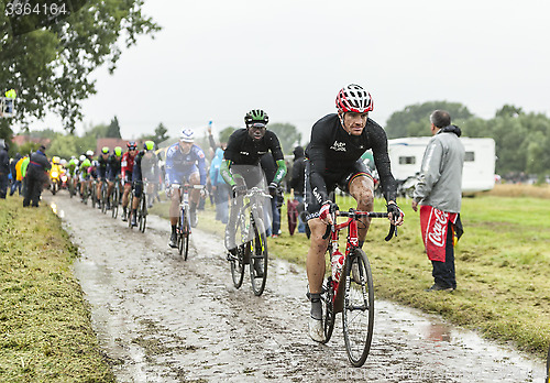 Image of The Cyclist Adam Hansen on a Cobbled Road - Tour de France 2014