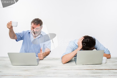 Image of The two colleagues working together at office on white background