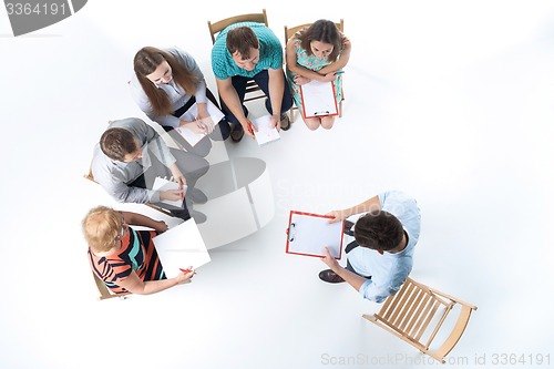 Image of Group of Business People in a Meeting