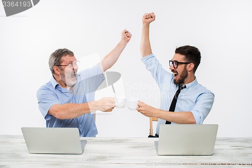 Image of The two colleagues working together at office on white background