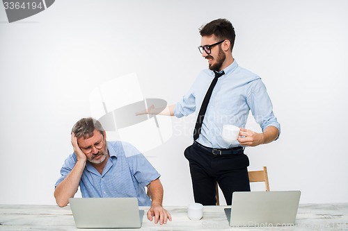 Image of The two colleagues working together at office on white background