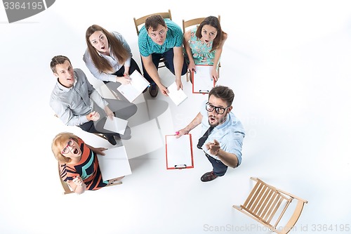 Image of Group of Business People in a Meeting