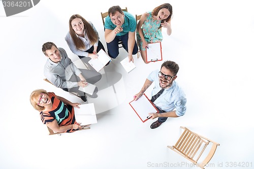 Image of Group of Business People in a Meeting