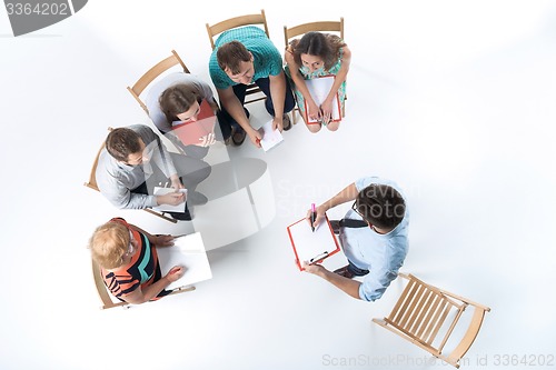 Image of Group of Business People in a Meeting