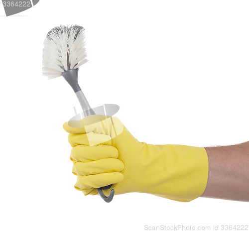 Image of Protection glove holding a dish-brush