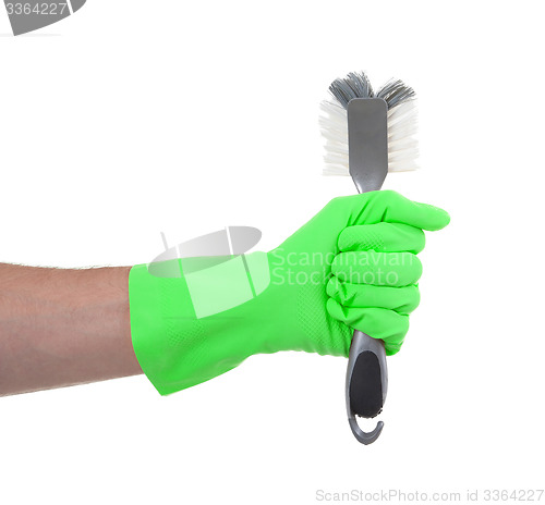 Image of Protection glove holding a dish-brush