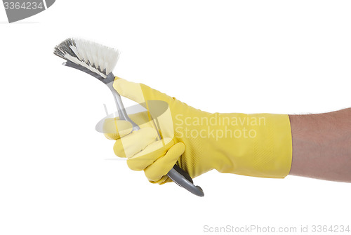 Image of Protection glove holding a dish-brush