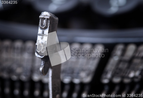 Image of U hammer - old manual typewriter - cold blue filter