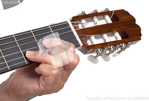 Image of Old hand and guitar isolated