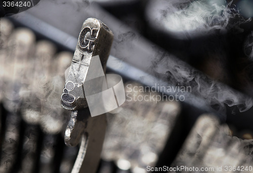 Image of G hammer - old manual typewriter - mystery smoke