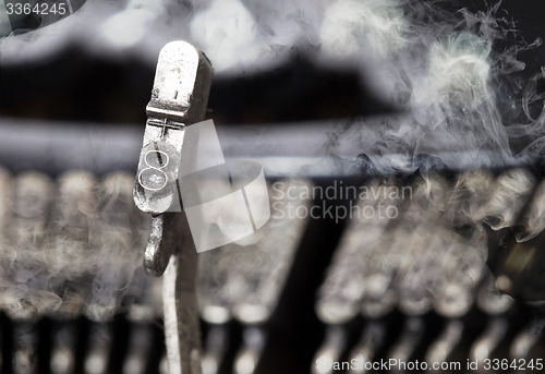 Image of 8 hammer - old manual typewriter - mystery smoke