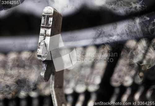 Image of I hammer - old manual typewriter - mystery smoke