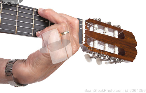 Image of Old hand and guitar isolated