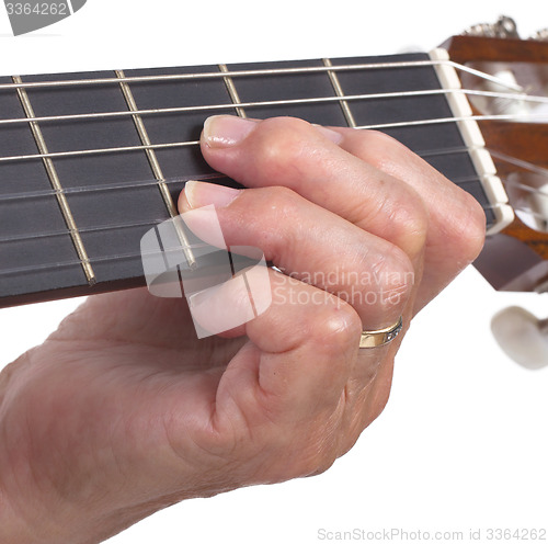 Image of Old hand and guitar isolated