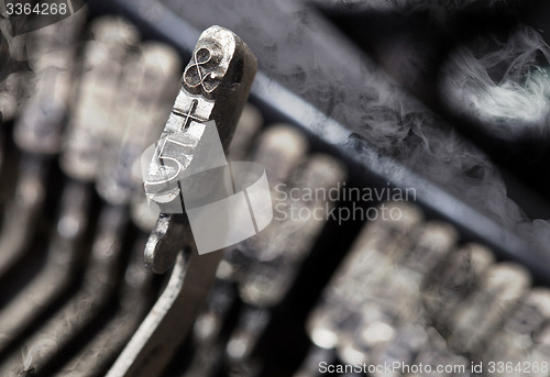 Image of 5 and ampersand hammer - old manual typewriter - mystery smoke