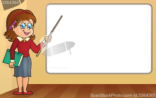 Image of Woman teacher standing by whiteboard