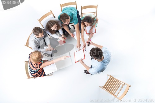 Image of Group of Business People in a Meeting