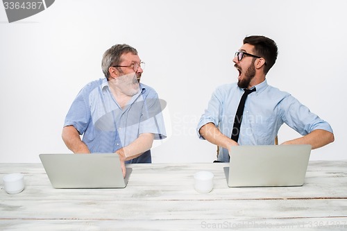 Image of The two colleagues working together at office on white background