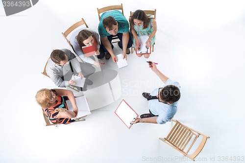 Image of Group of Business People in a Meeting