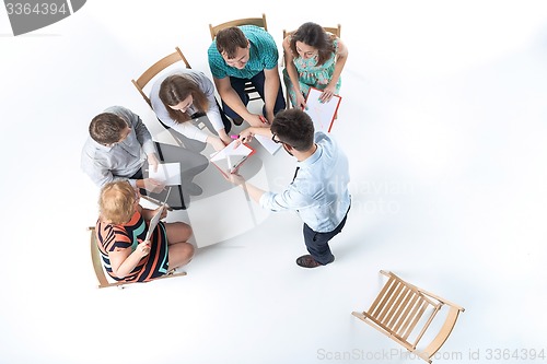 Image of Group of Business People in a Meeting