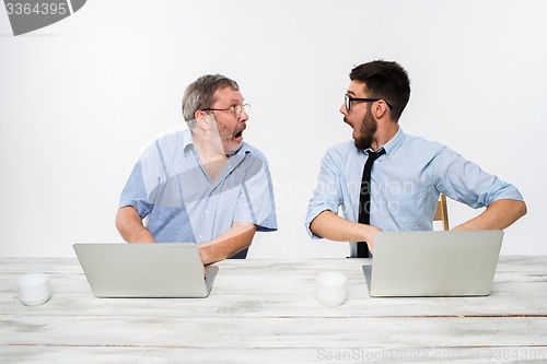 Image of The two colleagues working together at office on white background