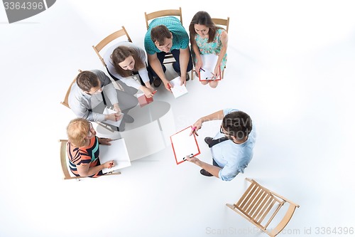 Image of Group of Business People in a Meeting