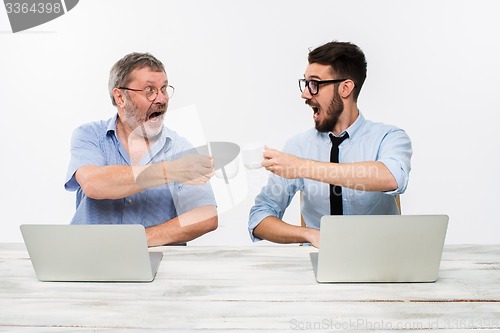 Image of The two colleagues working together at office on white background