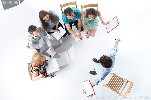Image of Group of Business People in a Meeting
