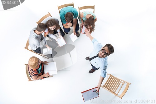 Image of Group of Business People in a Meeting